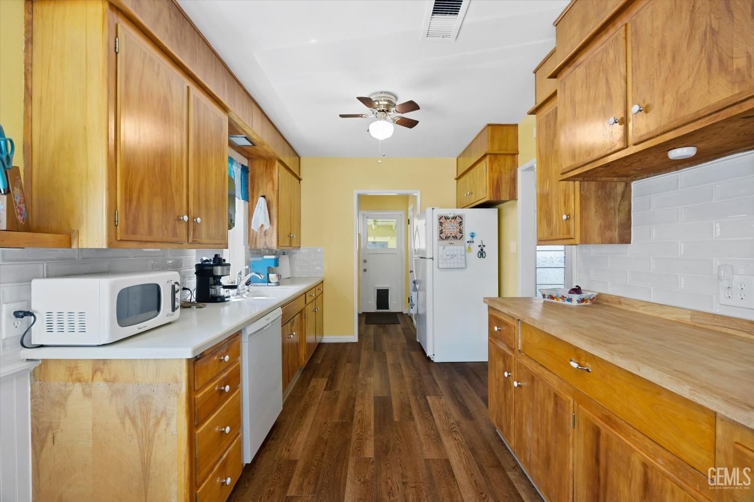 Undisclosed Address Bakersfield, CA 93305 - Photo 19 of 39 a kitchen with stainless steel appliances granite countertop a sink stove and refrigerator