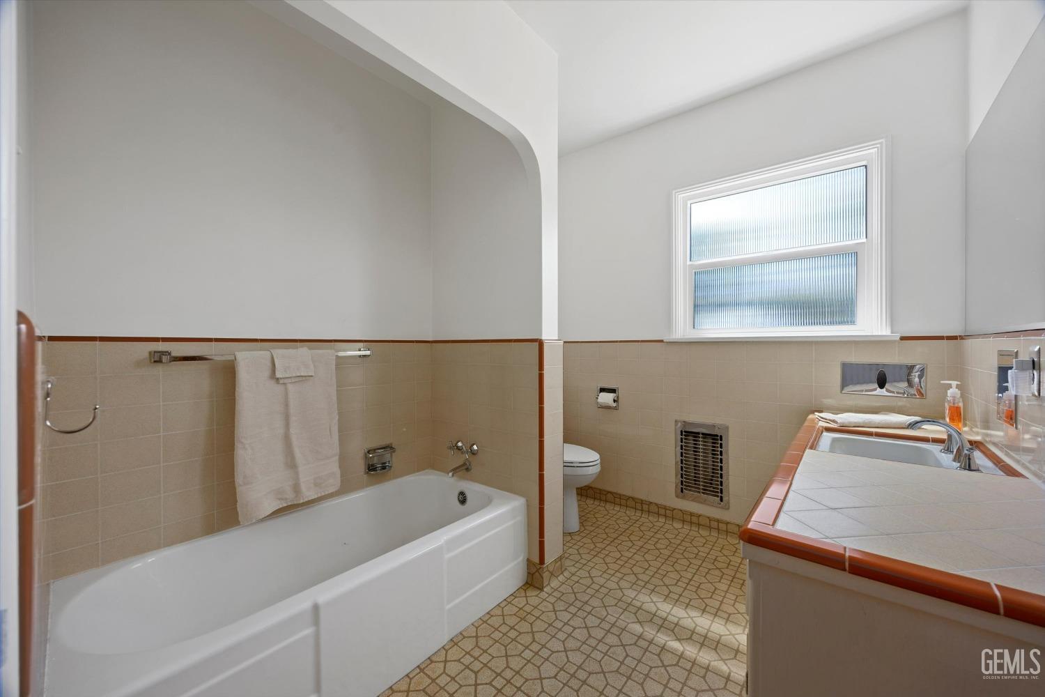 Undisclosed Address Bakersfield, CA 93305 - Photo 23 of 39 a bathroom with a tub sink and toilet