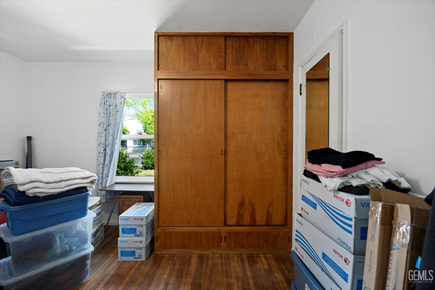 Undisclosed Address Bakersfield, CA 93305 - Photo 26 of 39 a bedroom with a bed and a window