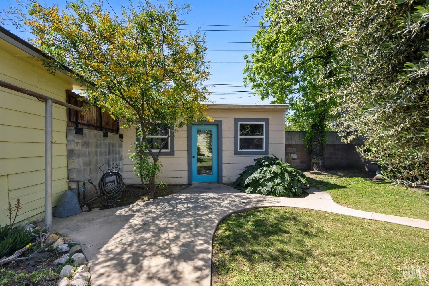 Undisclosed Address Bakersfield, CA 93305 - Photo 33 of 39 a front view of a house with garden