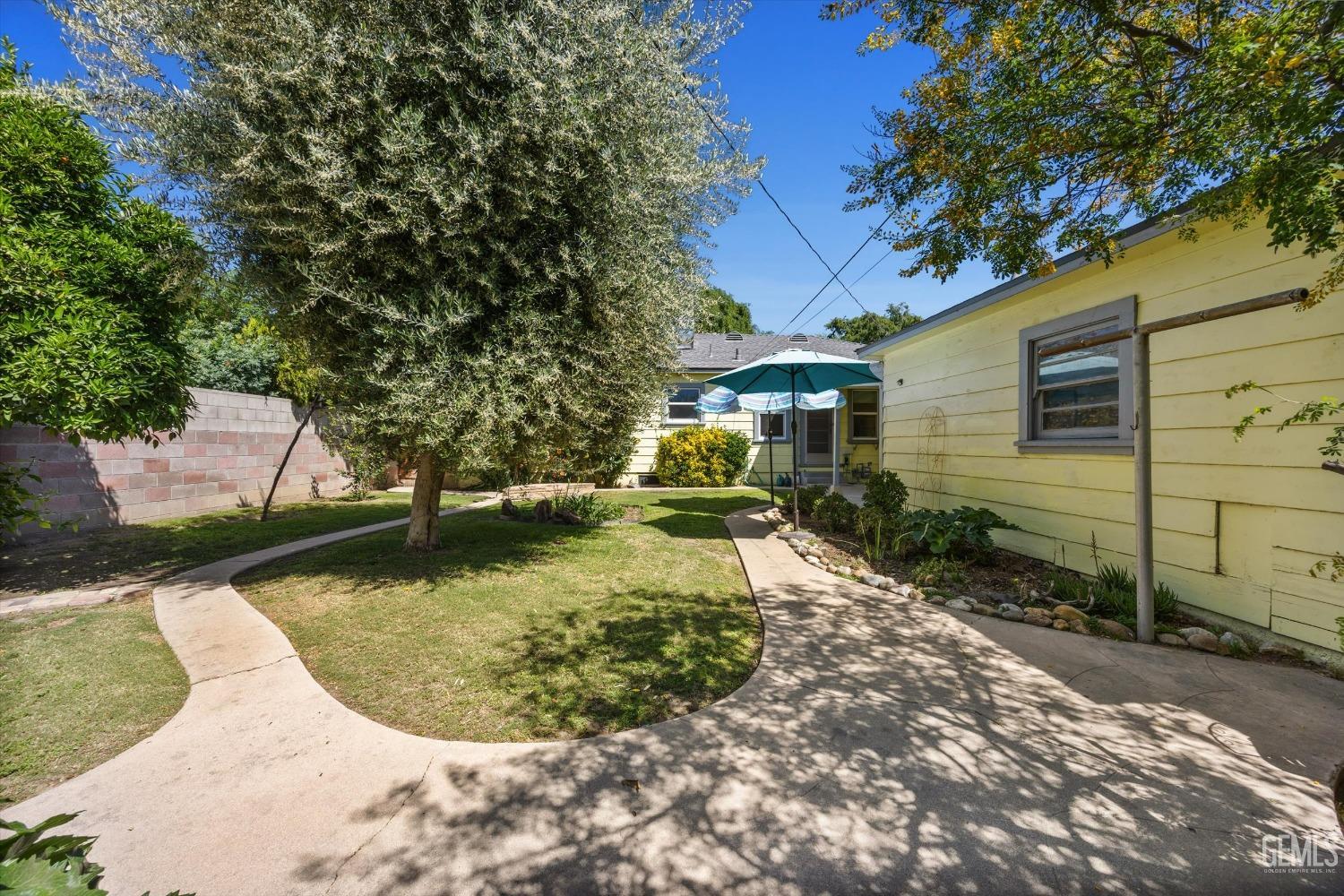 Undisclosed Address Bakersfield, CA 93305 - Photo 34 of 39 a view of a backyard with large trees