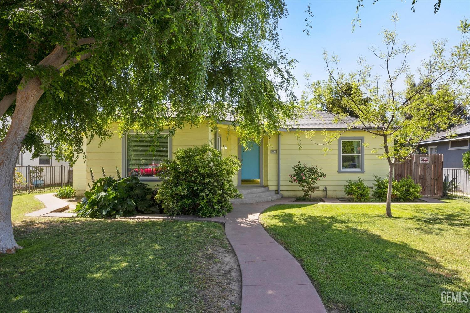 Undisclosed Address Bakersfield, CA 93305 - Photo 5 of 39 a view of a house with a big yard and large trees