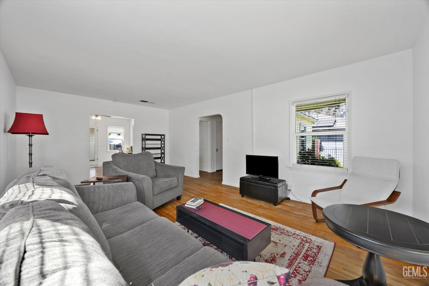 Undisclosed Address Bakersfield, CA 93305 - Photo 10 of 39 a living room with furniture and a flat screen tv