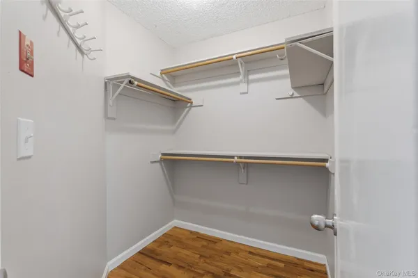 a view of a room with shelf on the wall
