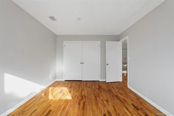 a view of room with wooden floor