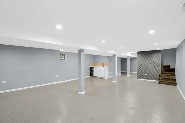 an empty room with furniture and white walls