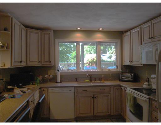 31 Allens Cove Road Charlestown, RI 02813 - Photo 2 of 10 Kitchen. Beautifully renovated kitchen with Quartz counter tops. Built in desk area and separate Jennair stove top.