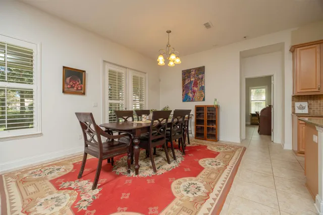 a living room with furniture a rug and a flat screen tv