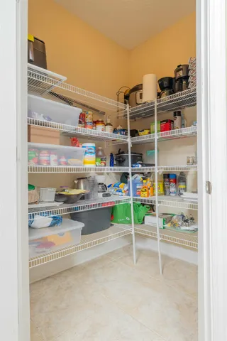 a view of a porch with chairs and backyard