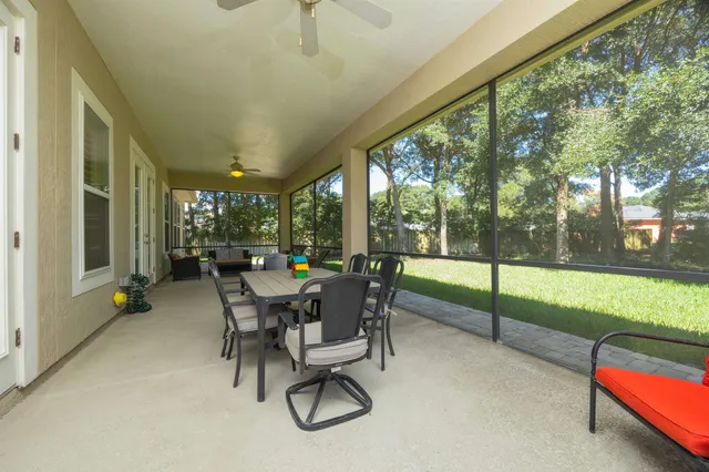 a view of a house with yard and green space