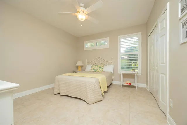 a bedroom with a bed and a closet