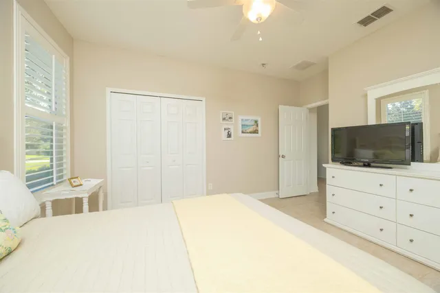 a view of green field with trees in the background