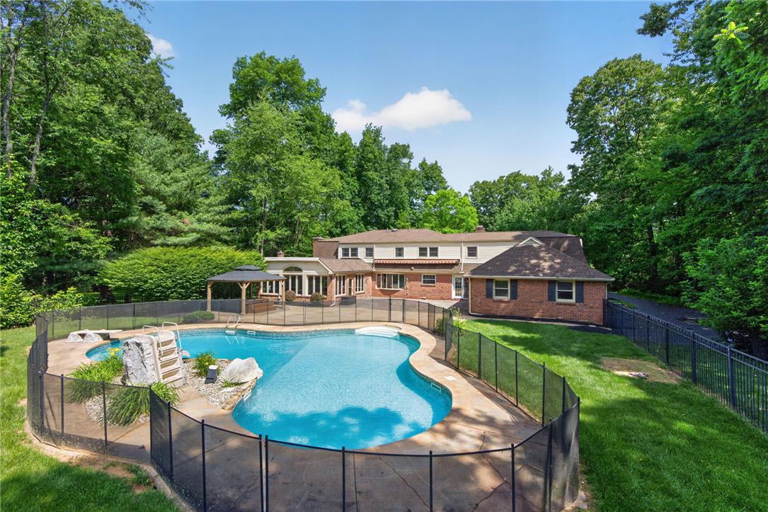 1371 Stoke Park Road Bethlehem, PA 18017 - Photo 6 of 55 an aerial view of a house with swimming pool garden view and lake view