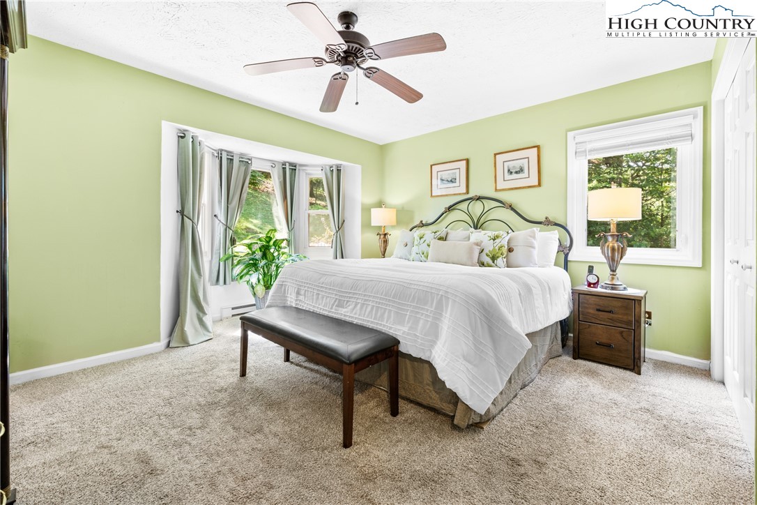 2587 Junaluska Road Boone, NC 28607 - Photo 17 of 47 a bedroom with a bed and a table