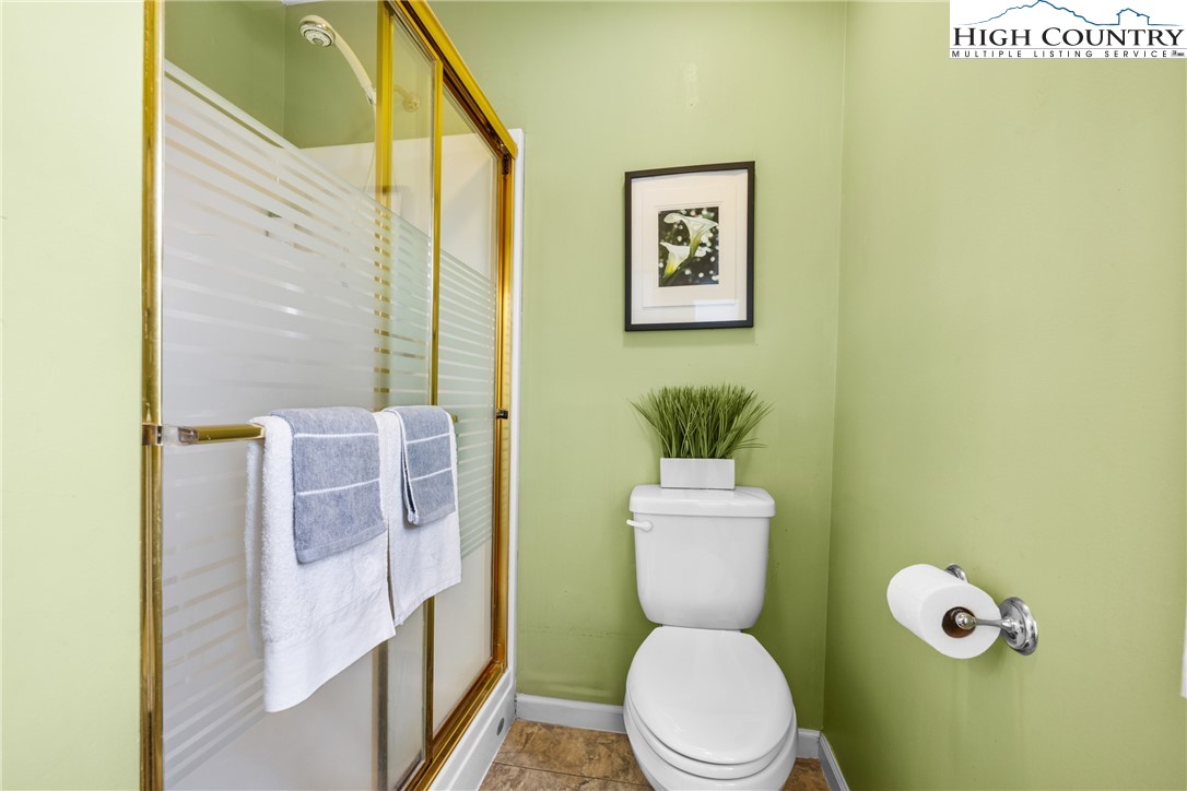 2587 Junaluska Road Boone, NC 28607 - Photo 21 of 47 a white toilet sitting next to a bathroom sink