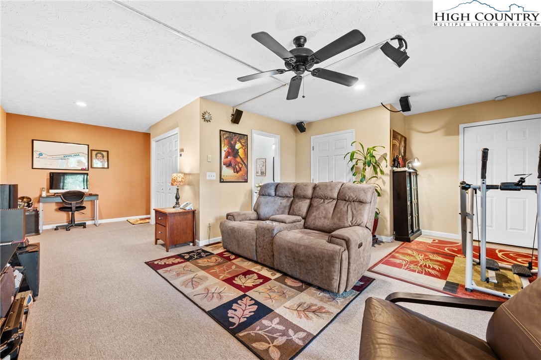 2587 Junaluska Road Boone, NC 28607 - Photo 28 of 47 a living room with furniture and a flat screen tv