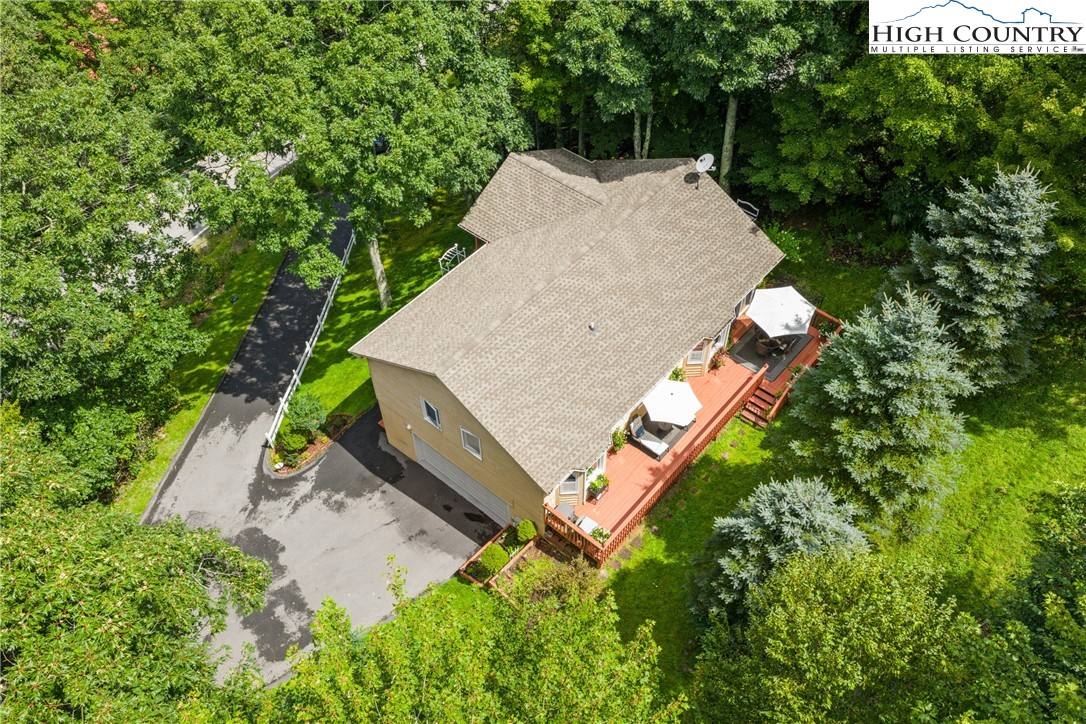 2587 Junaluska Road Boone, NC 28607 - Photo 40 of 47 an aerial view of a house with a yard and trees all around