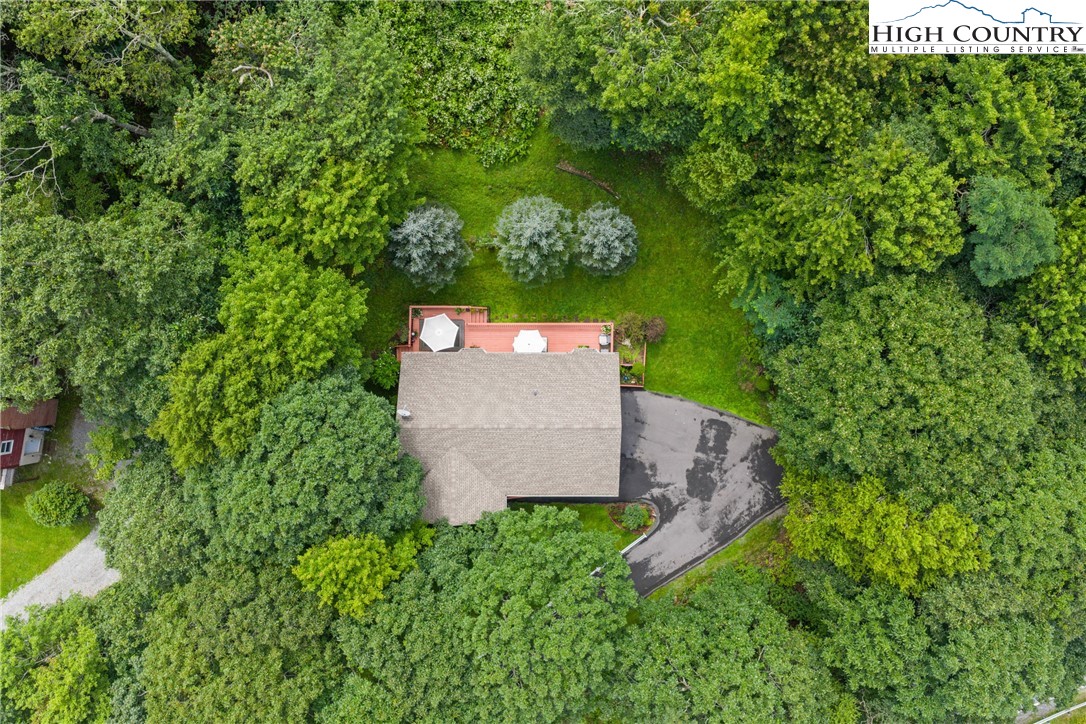 2587 Junaluska Road Boone, NC 28607 - Photo 41 of 47 an aerial view of a house with a yard and trees all around