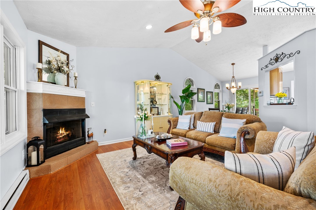 2587 Junaluska Road Boone, NC 28607 - Photo 6 of 47 a living room with furniture and a fireplace