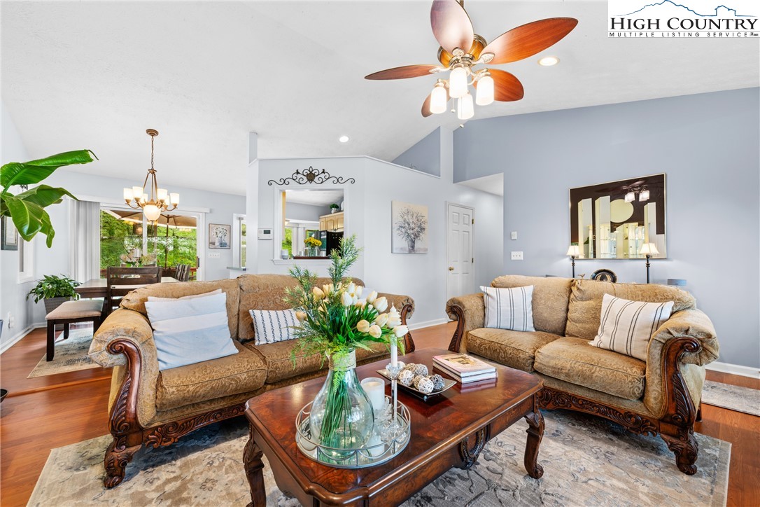 2587 Junaluska Road Boone, NC 28607 - Photo 8 of 47 a living room with furniture potted plant and kitchen view