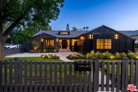 a front view of house yard and deck