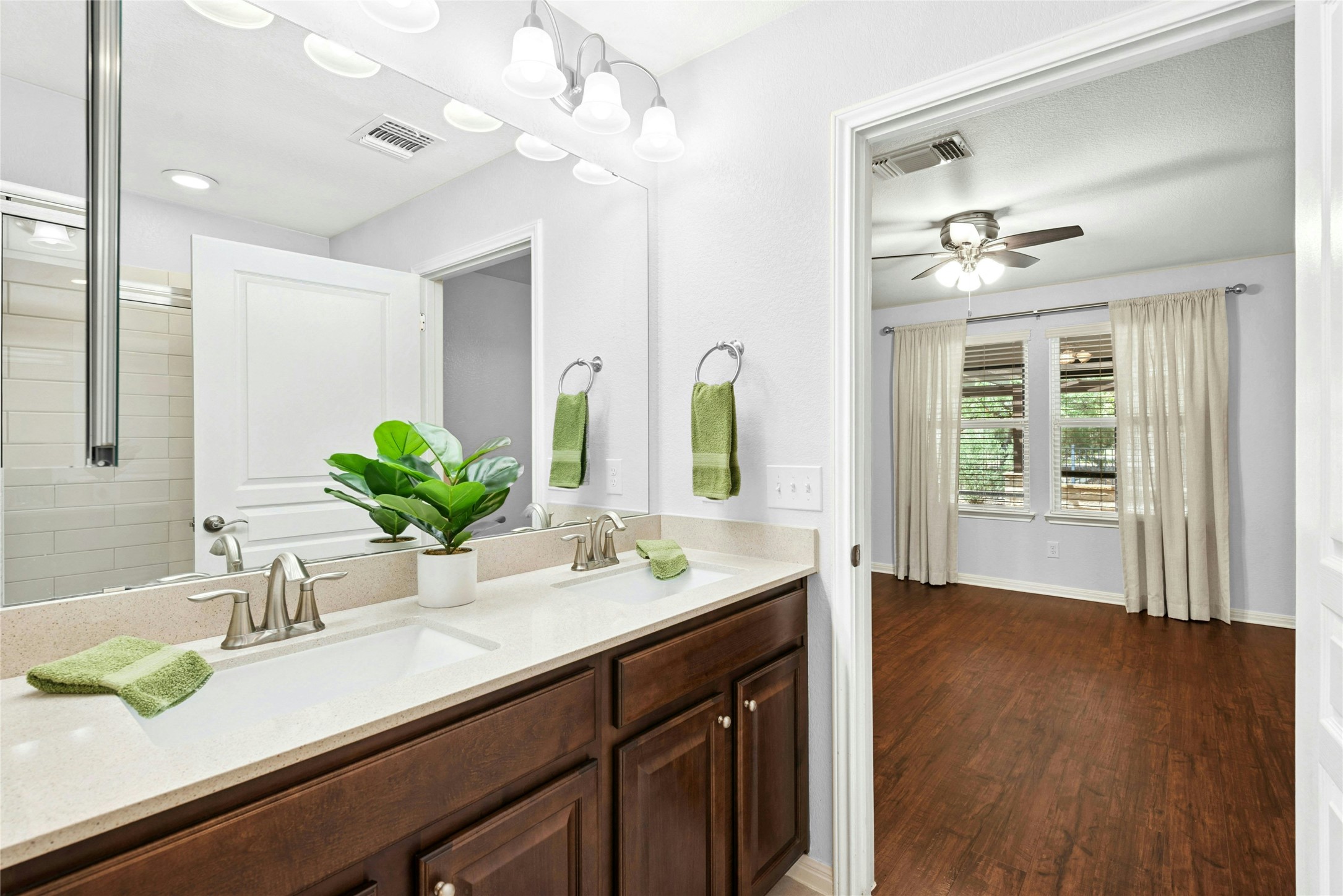 407 Fannin Court Georgetown, TX 78633 - Photo 17 of 40 a bathroom with a double vanity sink and a mirror