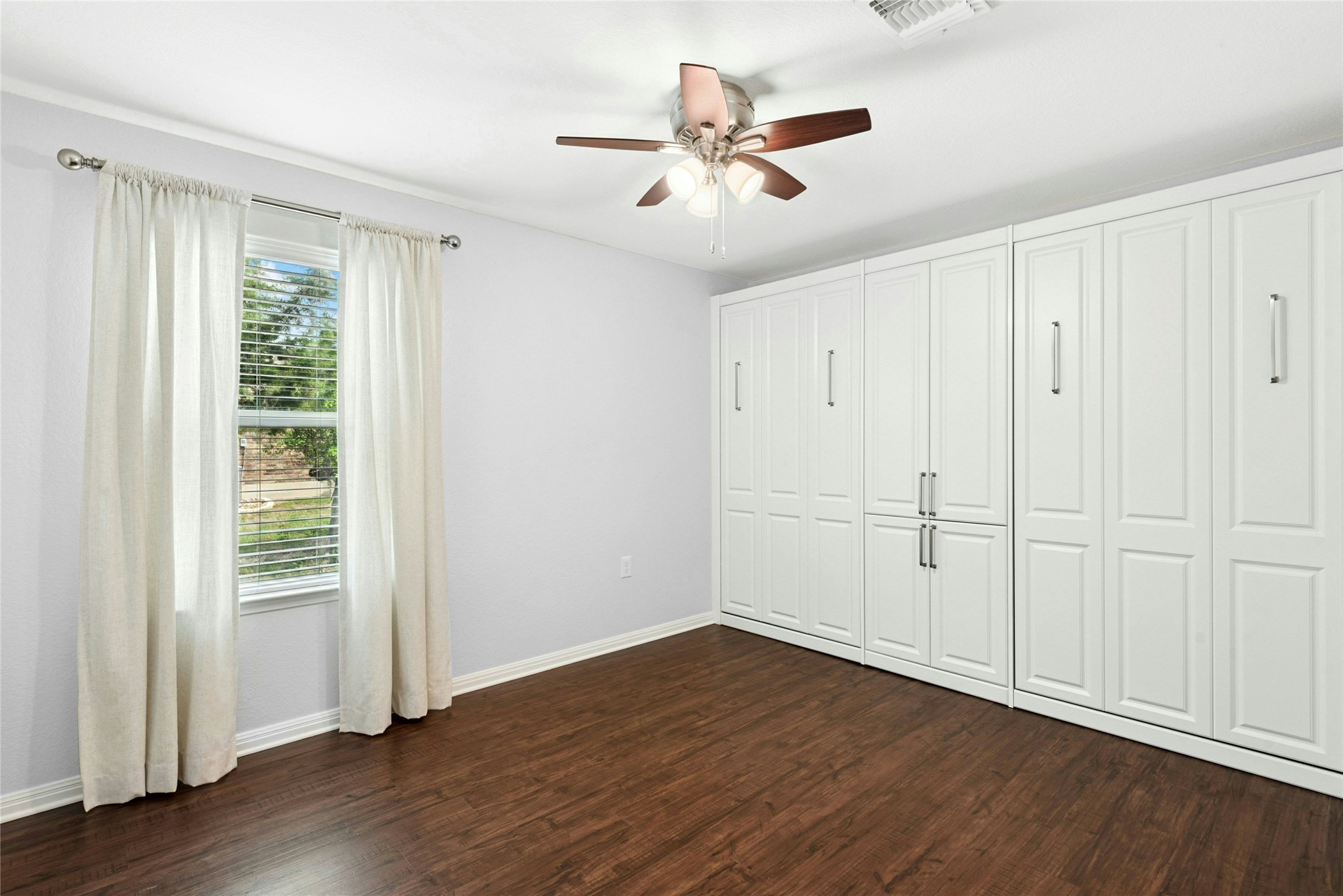 407 Fannin Court Georgetown, TX 78633 - Photo 20 of 40 wooden floor in an empty room with a window