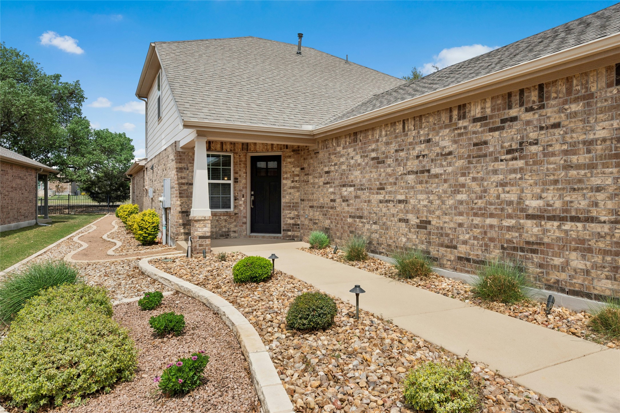 407 Fannin Court Georgetown, TX 78633 - Photo 2 of 40 a front view of a house with garden