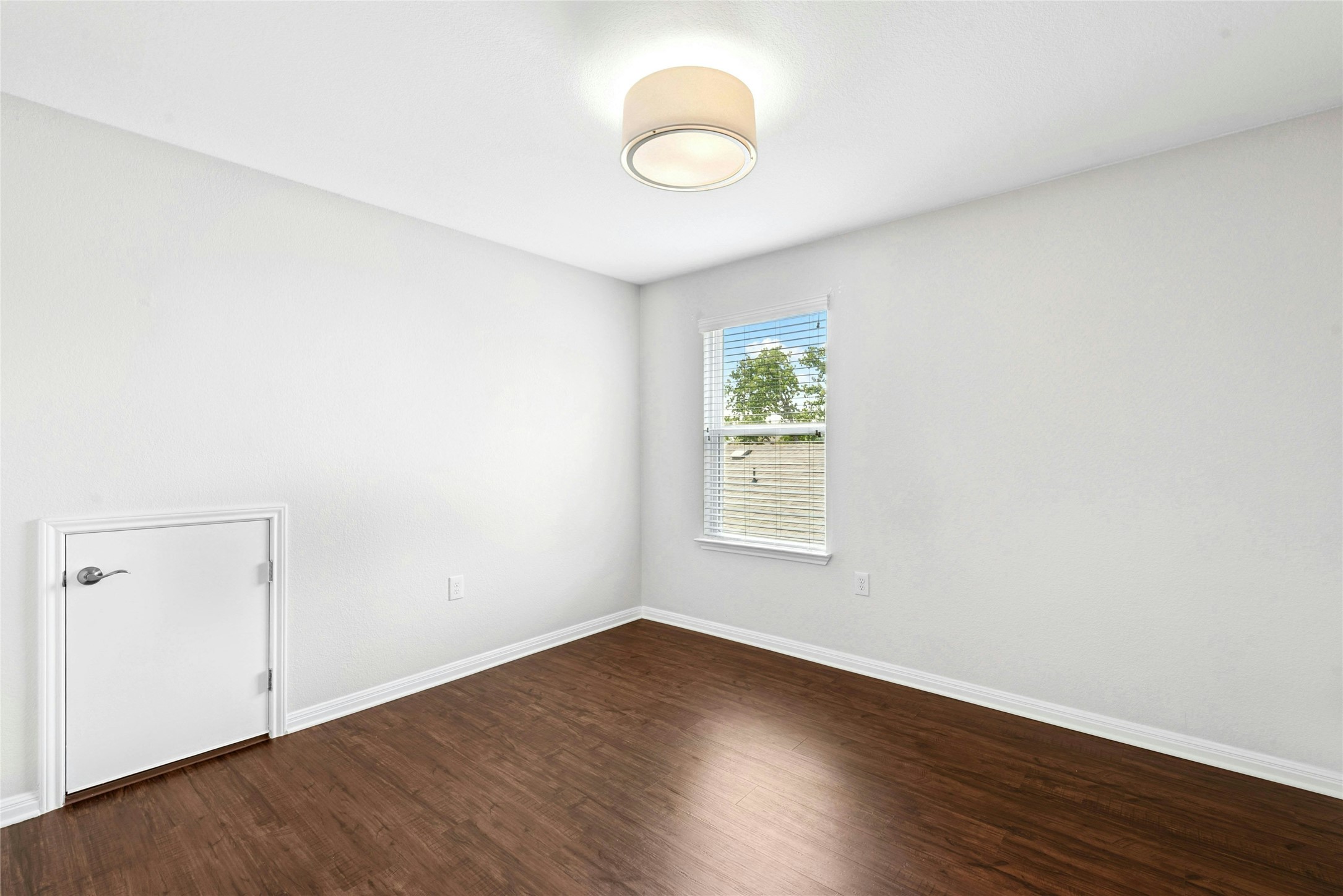 407 Fannin Court Georgetown, TX 78633 - Photo 25 of 40 an empty room with wooden floor and windows