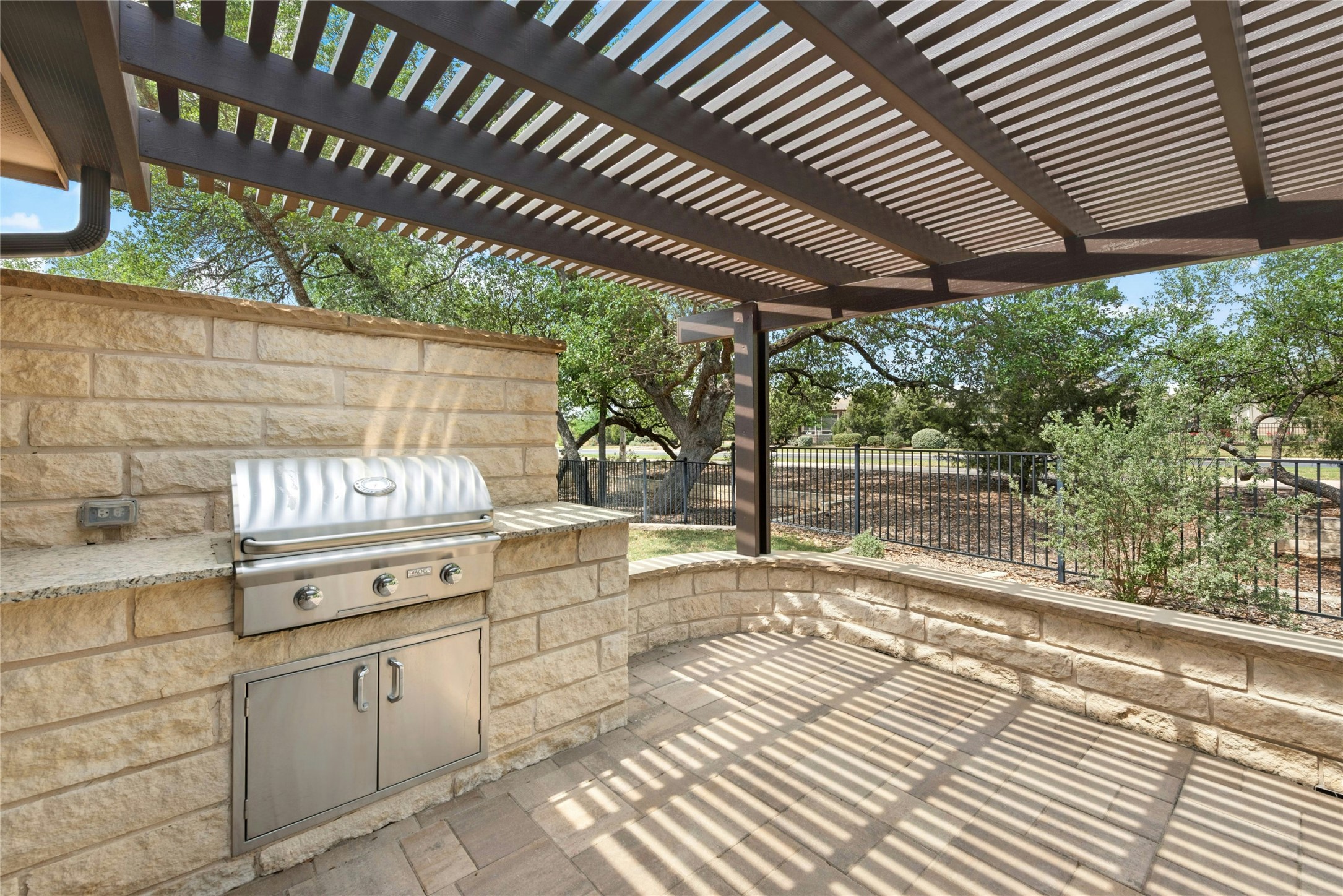 407 Fannin Court Georgetown, TX 78633 - Photo 31 of 40 a kitchen with stainless steel appliances kitchen island granite countertop a sink and cabinets