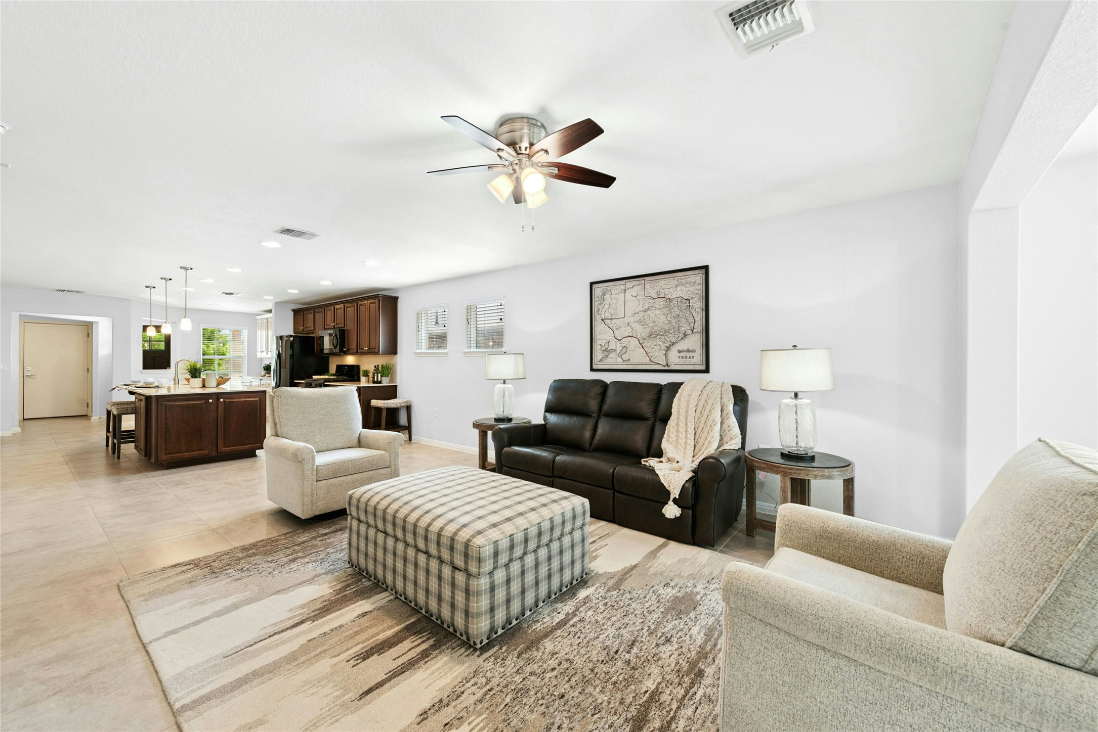 407 Fannin Court Georgetown, TX 78633 - Photo 4 of 40 a living room with furniture ceiling fan and a rug
