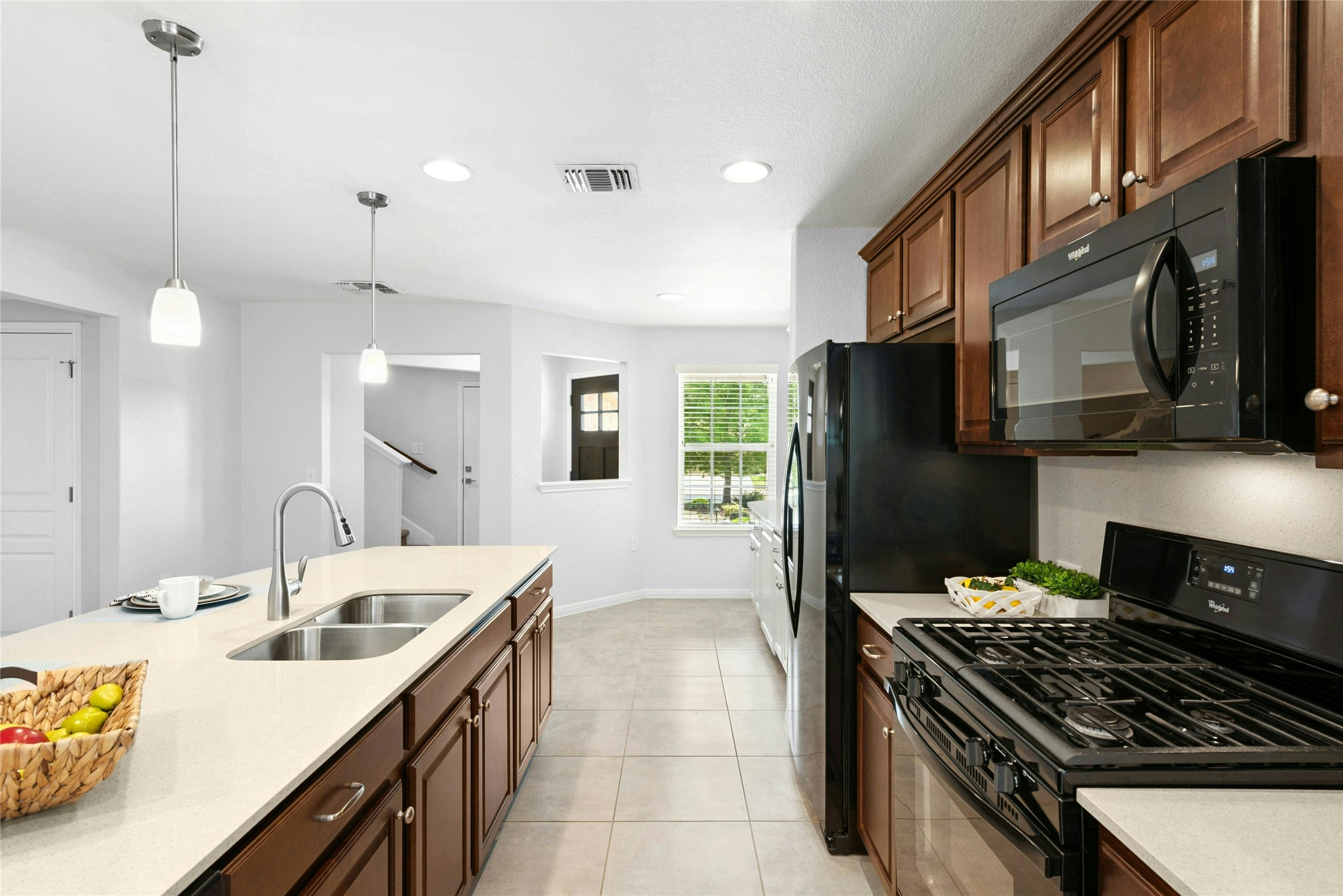 407 Fannin Court Georgetown, TX 78633 - Photo 9 of 40 a kitchen with a sink stove and refrigerator