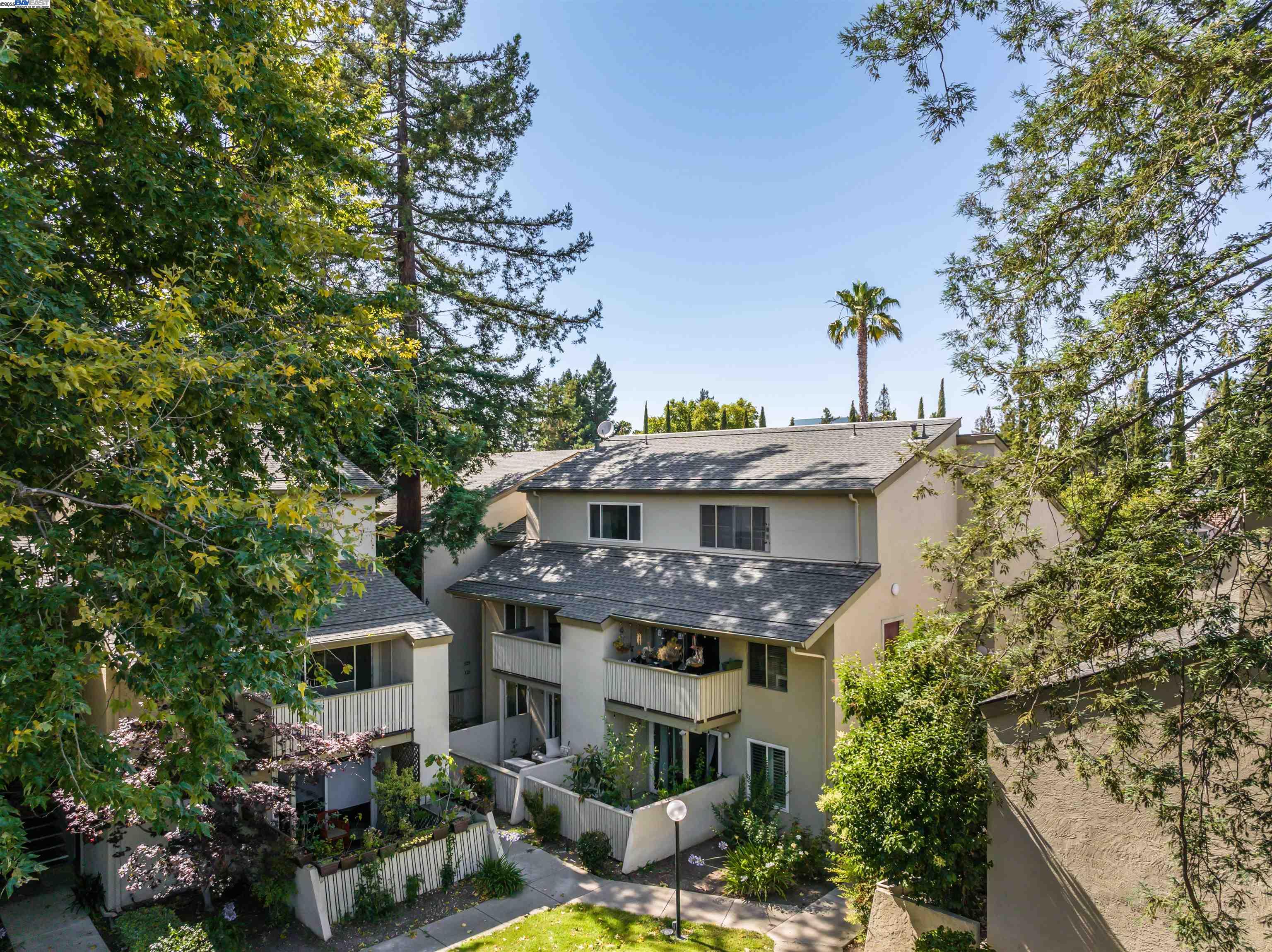 2720 Oak Road, Unit 131 Walnut Creek, CA 94597 - Photo 1 of 1 a front view of a house with a garden