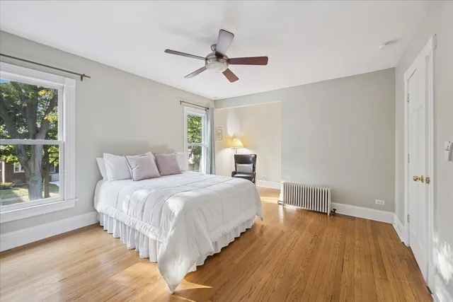 a bed room with a bed and a window