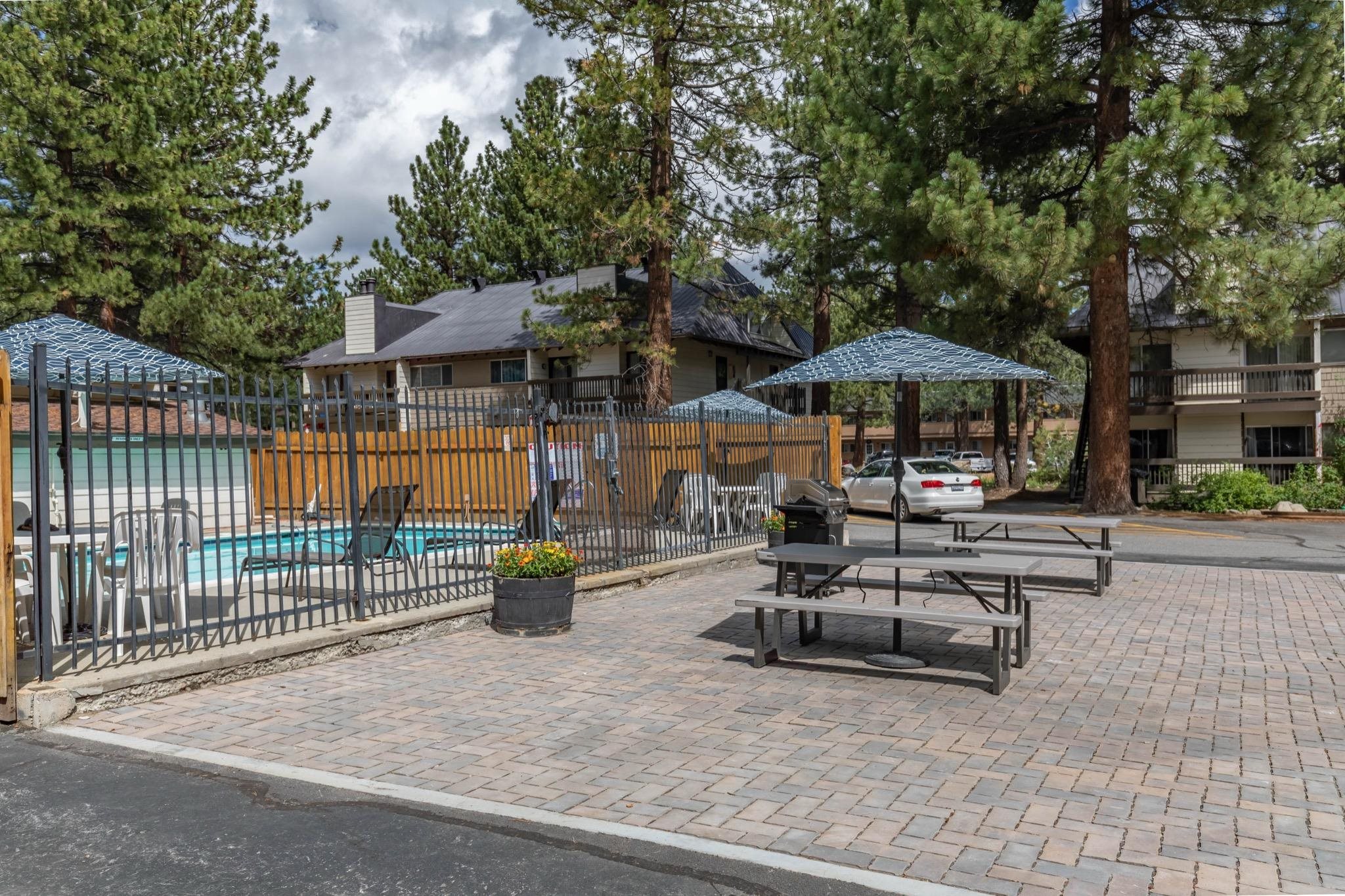 2289 Sierra Nevada Road, Unit G10 Mammoth Lakes, CA 93546 - Photo 22 of 23 View of patio featuring a community pool