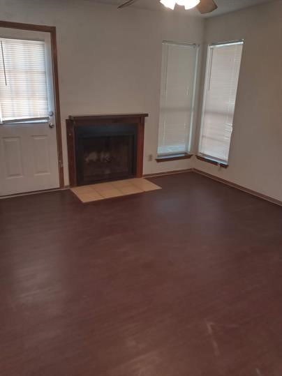a view of empty room with a fireplace