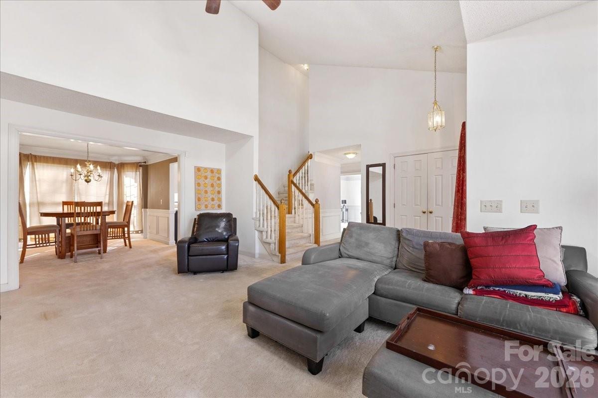 4107 Brownes Ferry Road Charlotte, NC 28269 - Photo 12 of 42 a living room with furniture and a flat screen tv