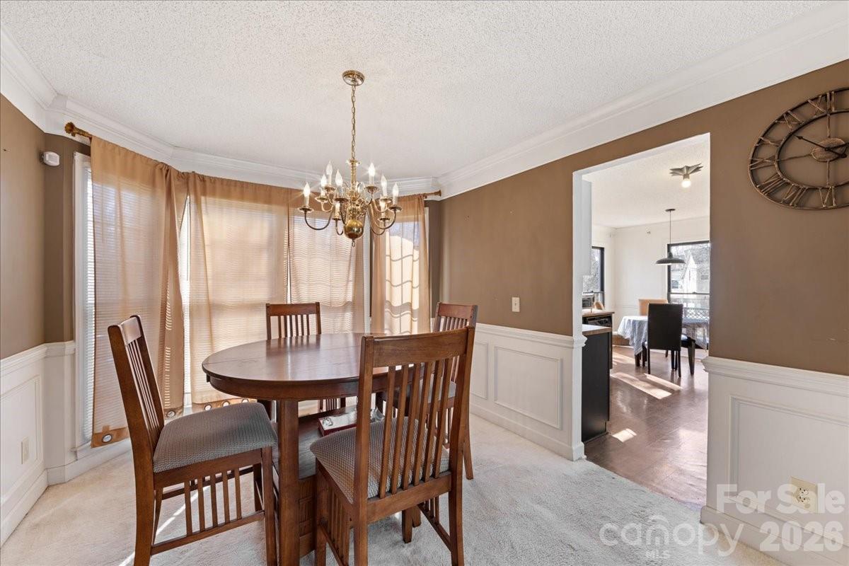 4107 Brownes Ferry Road Charlotte, NC 28269 - Photo 14 of 42 a view of a dining room with furniture window and outside view