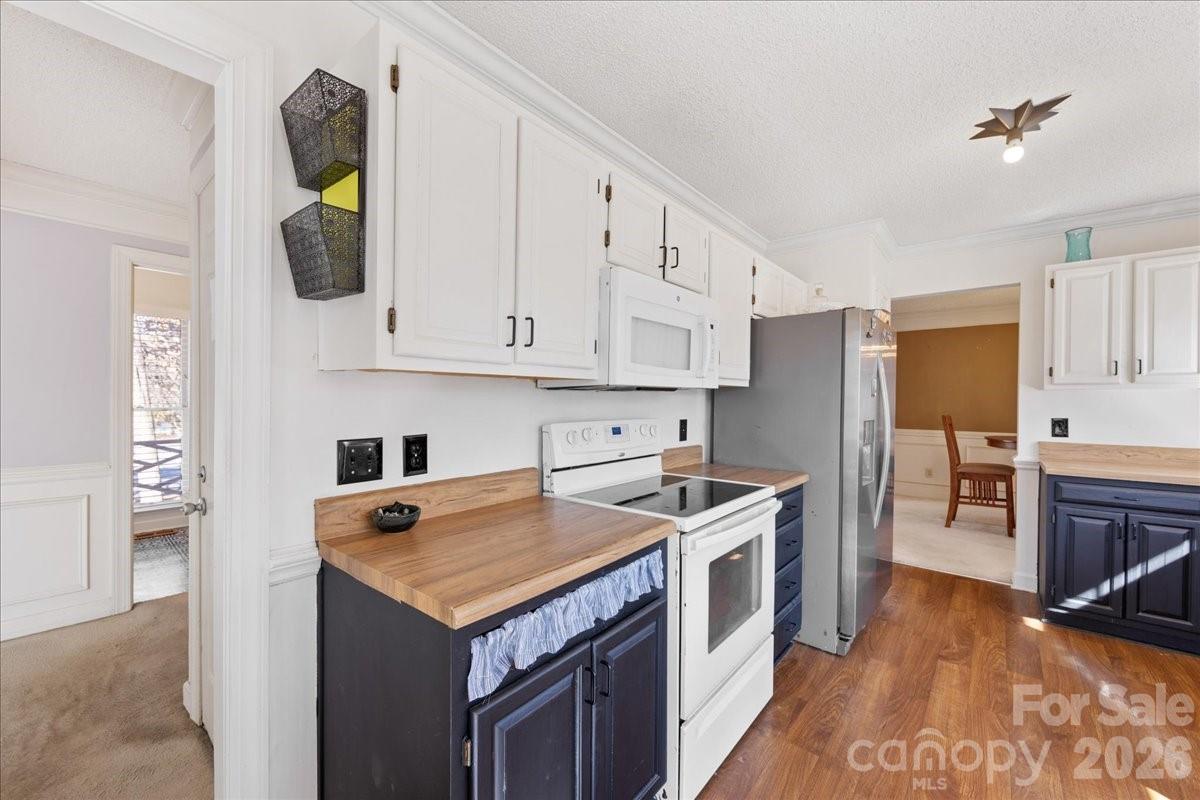 4107 Brownes Ferry Road Charlotte, NC 28269 - Photo 19 of 42 a kitchen with stainless steel appliances granite countertop a stove a refrigerator and a sink