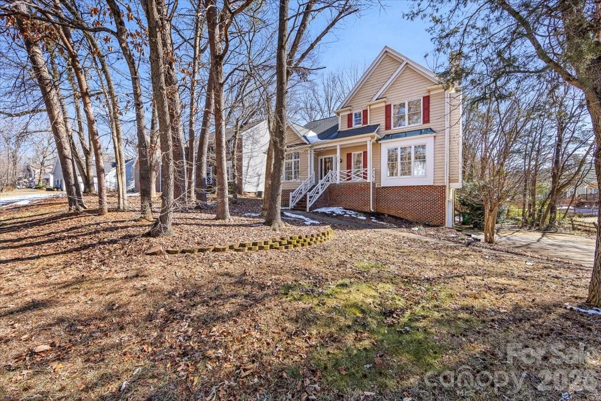 4107 Brownes Ferry Road Charlotte, NC 28269 - Photo 2 of 42 a front view of a house with a yard