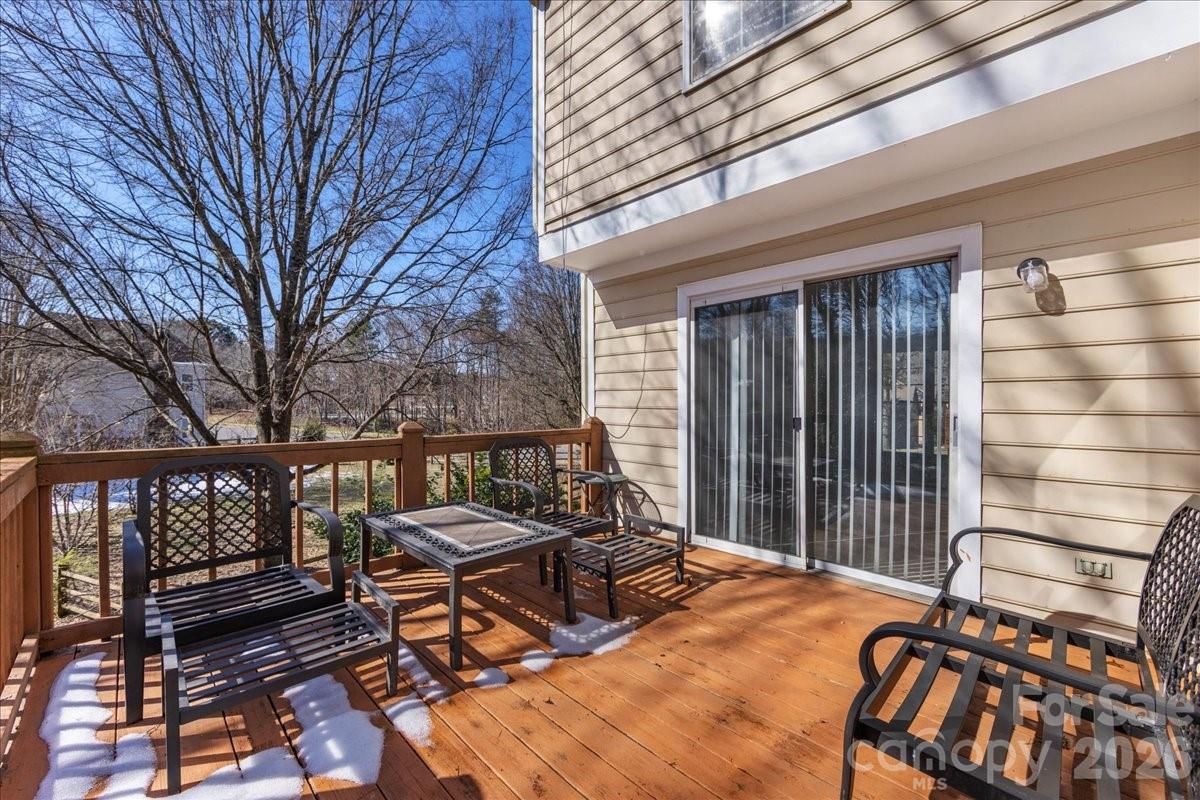 4107 Brownes Ferry Road Charlotte, NC 28269 - Photo 40 of 42 a backyard of a house with barbeque oven table and chairs