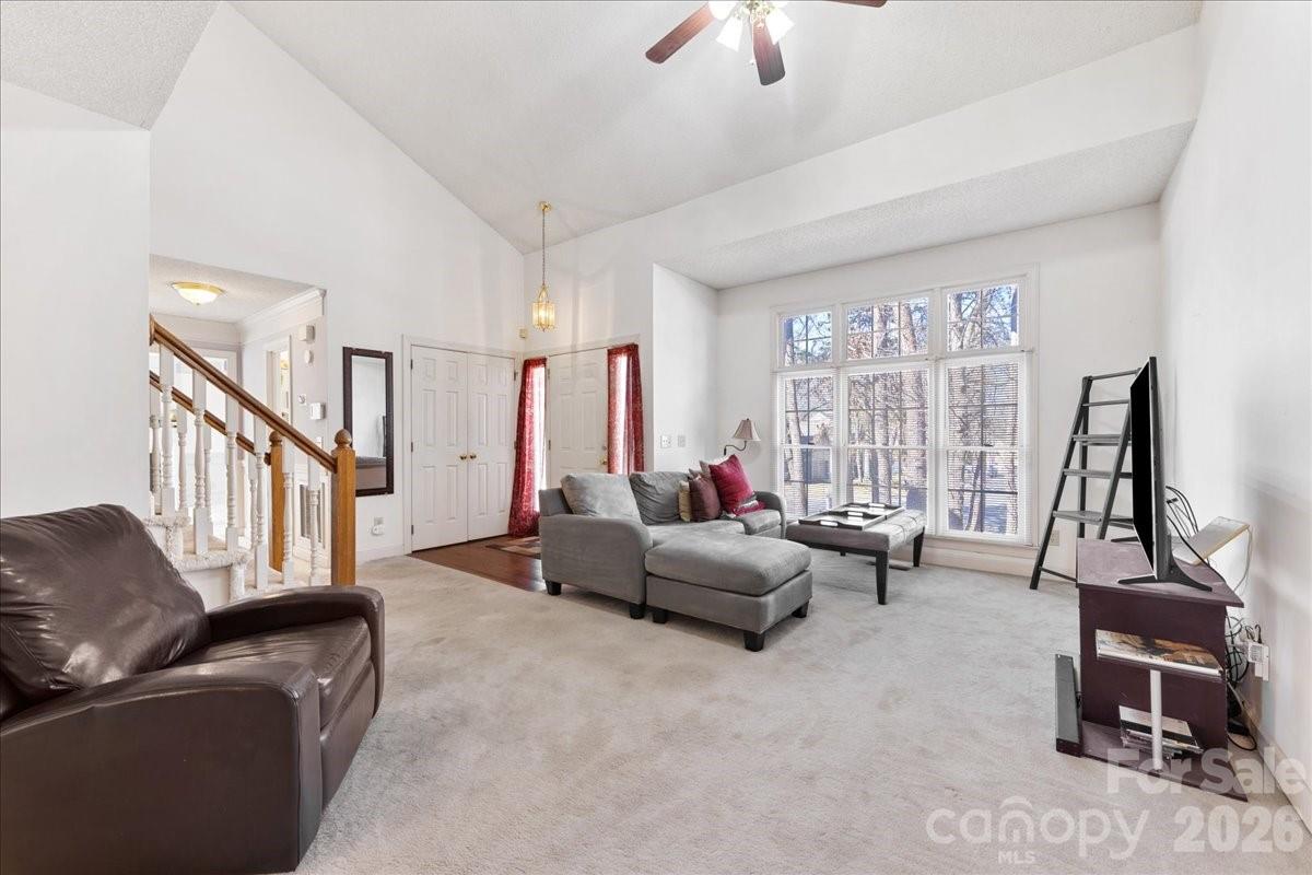 4107 Brownes Ferry Road Charlotte, NC 28269 - Photo 9 of 42 a living room with furniture and a flat screen tv