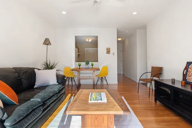 a living room with furniture rug and window