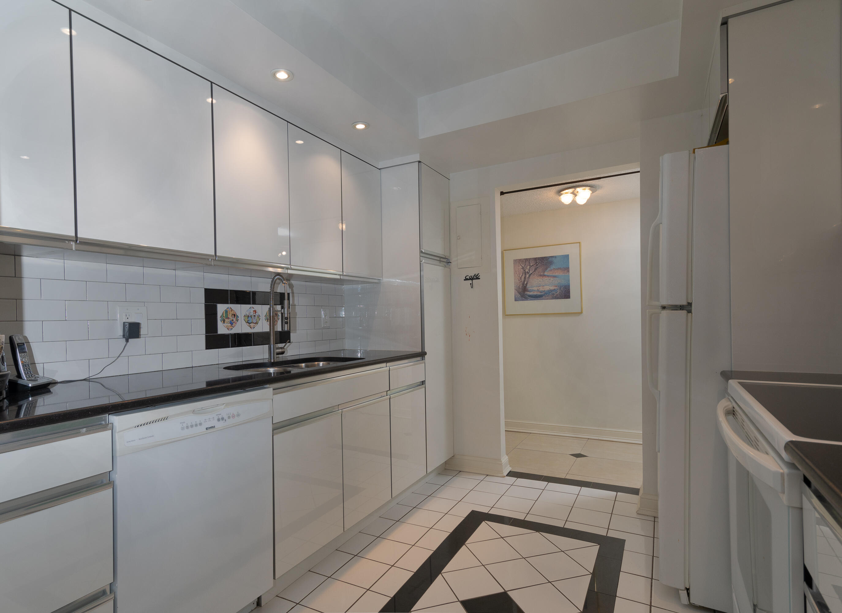 951 De Soto Road, Unit 427 Boca Raton, FL 33432 - Photo 15 of 44 a kitchen with stainless steel appliances granite countertop a sink and cabinets