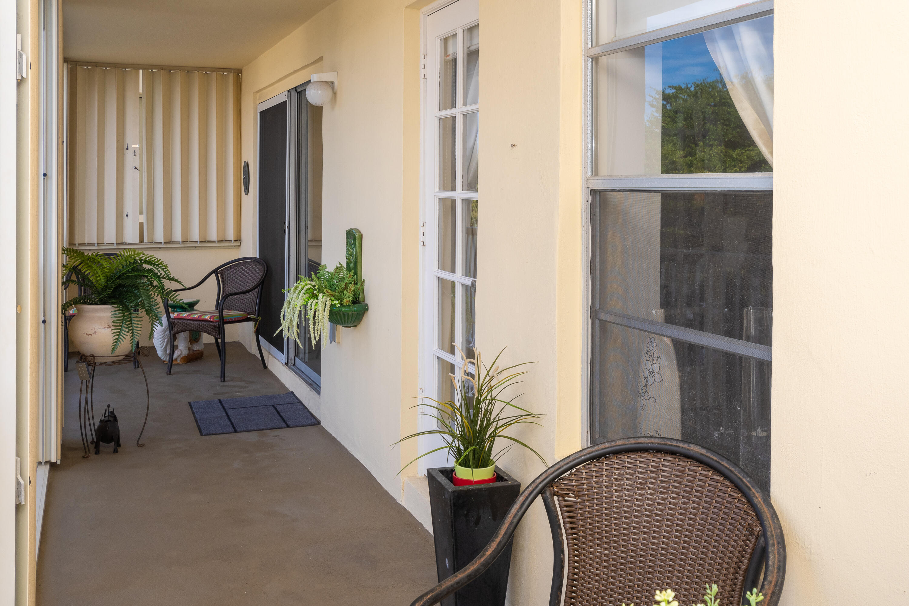 951 De Soto Road, Unit 427 Boca Raton, FL 33432 - Photo 22 of 44 an entryway with wooden floor and a potted plant
