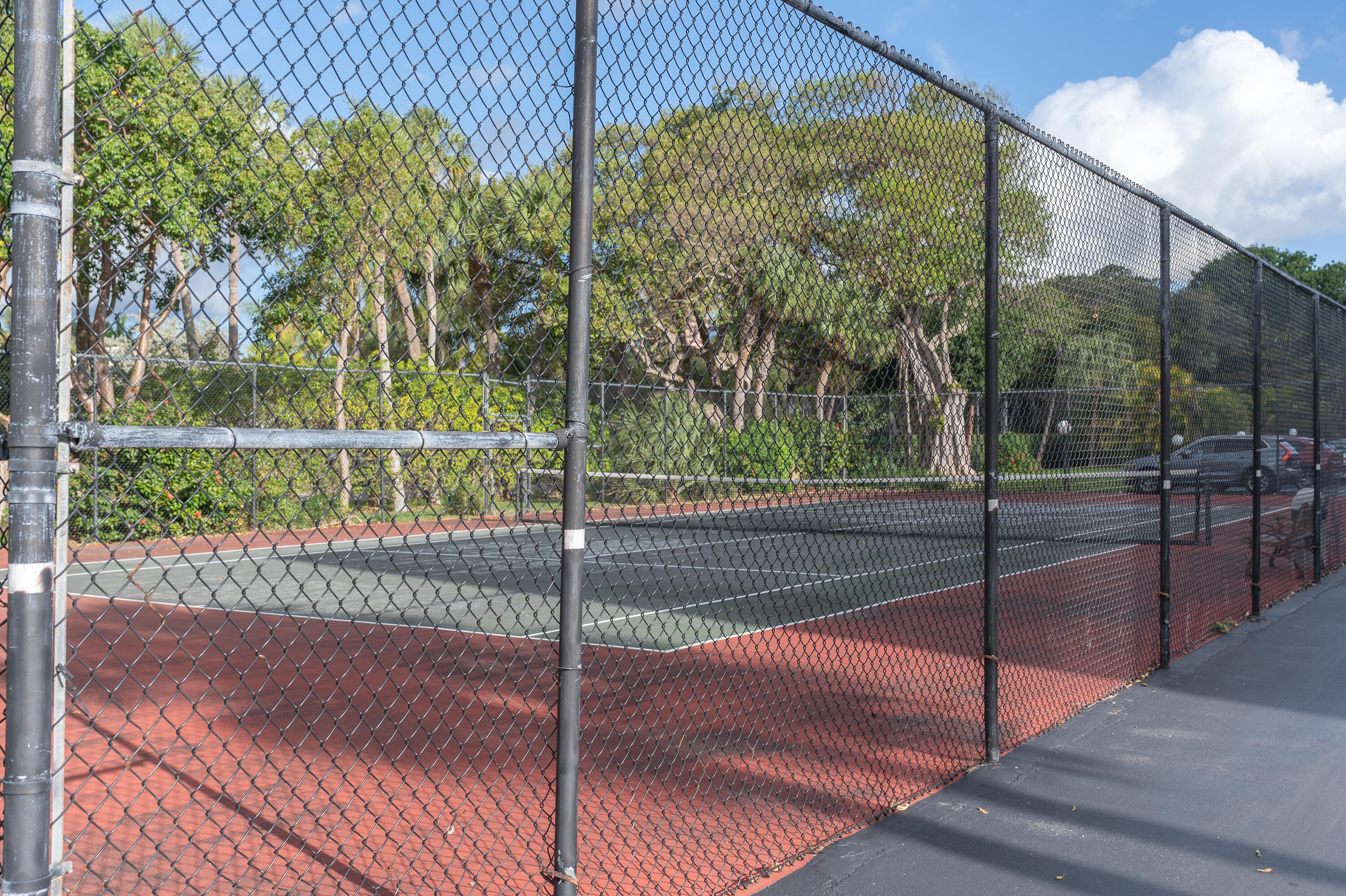 951 De Soto Road, Unit 427 Boca Raton, FL 33432 - Photo 33 of 44 a view of a yard and basketball court
