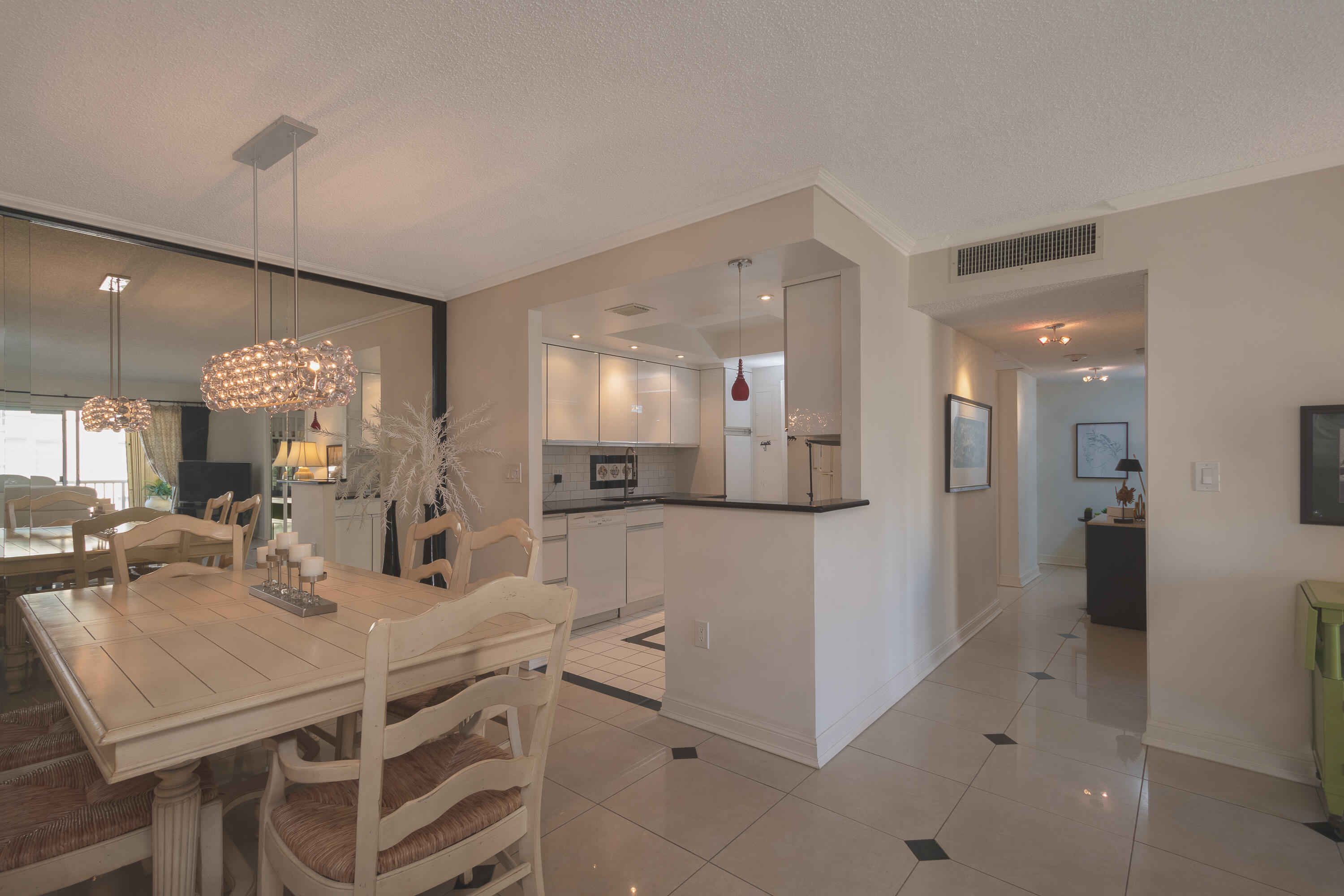 951 De Soto Road, Unit 427 Boca Raton, FL 33432 - Photo 8 of 44 a kitchen with a table and chairs