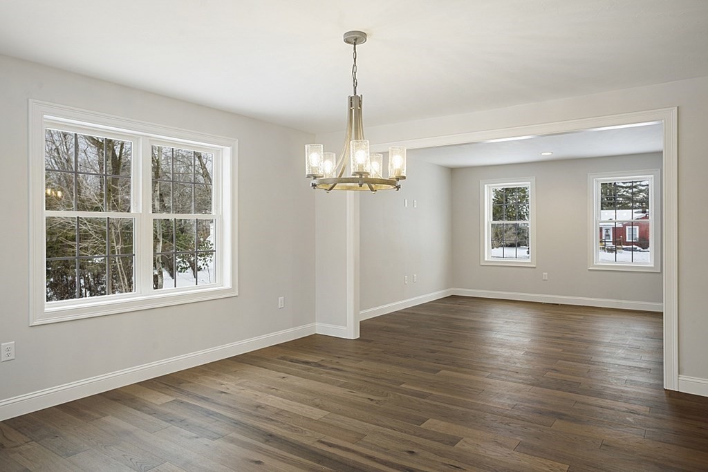 182 Davis Road Westminster, MA 01473 - Photo 14 of 42 wooden floor in an empty room with a window