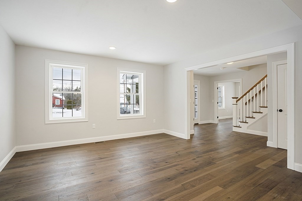 182 Davis Road Westminster, MA 01473 - Photo 15 of 42 a view of an empty room with wooden floor and a window