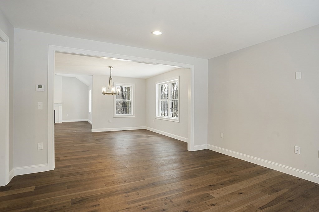 182 Davis Road Westminster, MA 01473 - Photo 17 of 42 a view of an empty room with wooden floor and a window
